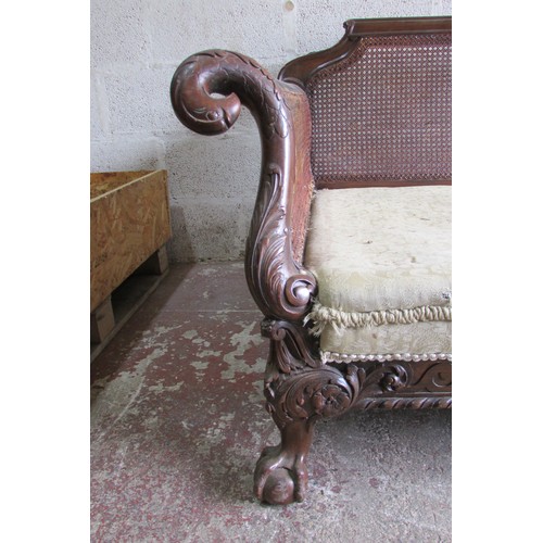 1456 - An good 19th century mahogany three piece bergere suite, the carved show wood frame with acanthus, s... 