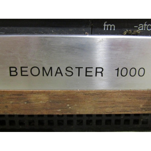 1135 - A vintage Bang & Olufsen audio set comprising Beomaster 1000, a 1000 Beogram record deck, and a pair... 