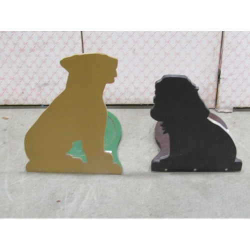 1180 - Two painted dummy boards depicting a Labrador and a Spaniel, each shaped to fit a dog bowl