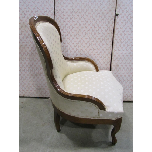 1230 - A Victorian style drawing room chair with upholstered finish