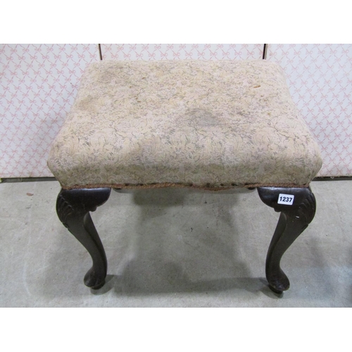 1237 - A 19th century centre stool raised on four cabriole supports with carved detail, and one other