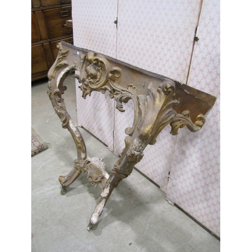 1306 - A 19th century gilt plaster console table frame with acanthus and other detail together with a gilde... 