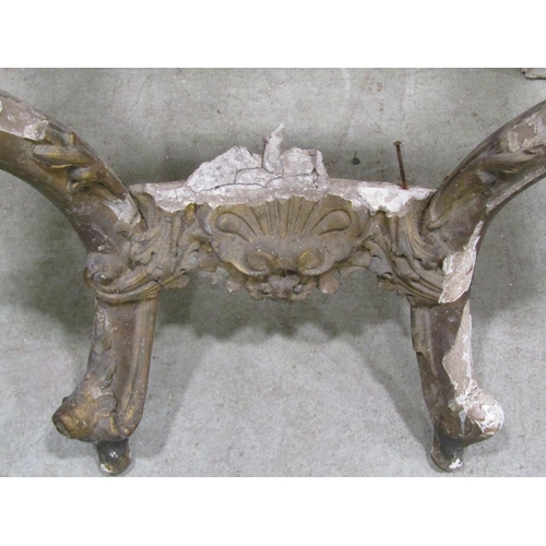 1306 - A 19th century gilt plaster console table frame with acanthus and other detail together with a gilde... 