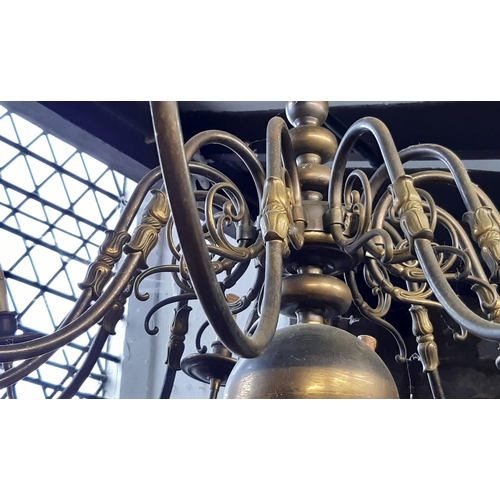 1265A - A large 12 branch chandelier in brass over 1m diameter