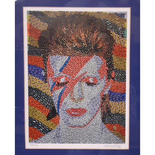 1733 - A collection of David Bowie related music and ephemera, to include: CDs, DVDs and Singles vinyl reco... 