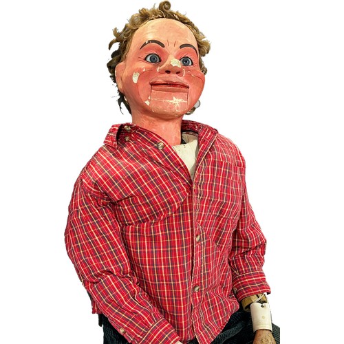 574 - A Ventriloquist Dummy, with working mouth and eyes, 90cm tall approximately.