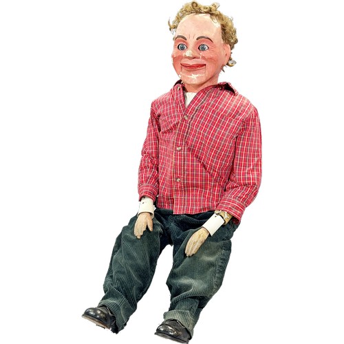 574 - A Ventriloquist Dummy, with working mouth and eyes, 90cm tall approximately.