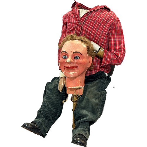 574 - A Ventriloquist Dummy, with working mouth and eyes, 90cm tall approximately.