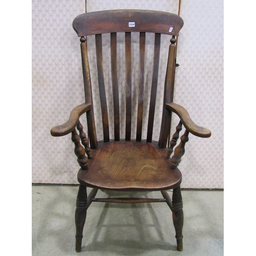 1234 - A Windsor lathe back elbow chair principally in elm and beech wood