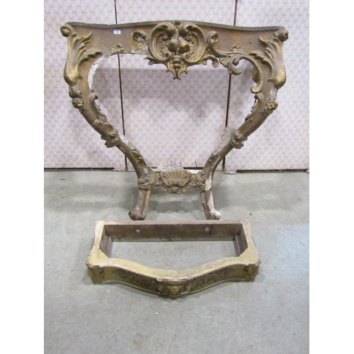 1306 - A 19th century gilt plaster console table frame with acanthus and other detail together with a gilde... 