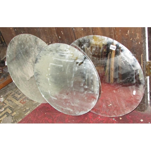 1298 - Three frameless convex wall mirrors of circular form, each 47cm diameter