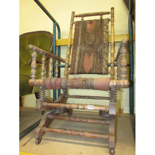 1320 - An American rocking chair of usual form