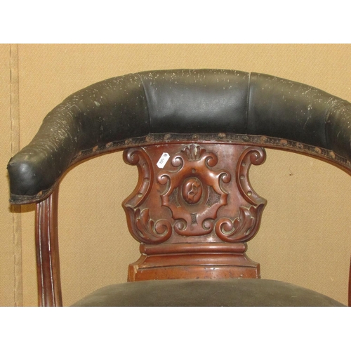 1327 - A 19th century mahogany library chair with carved splat, horseshoe shaped back and circular seat on ... 