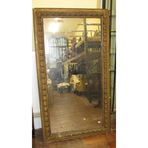 1330 - A 19th century wall mirror of rectangular form within a preannounced moulded border, 144cm x 81cm