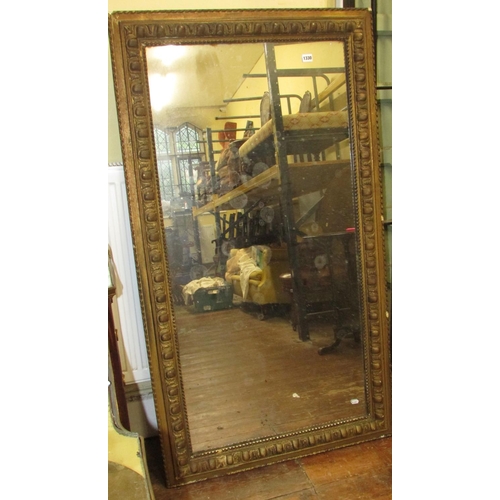 1330 - A 19th century wall mirror of rectangular form within a preannounced moulded border, 144cm x 81cm