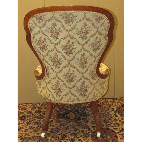 1331 - A Victorian drawing room chair, the carved show wood frame in solid satin wood, raised on cabriole s... 