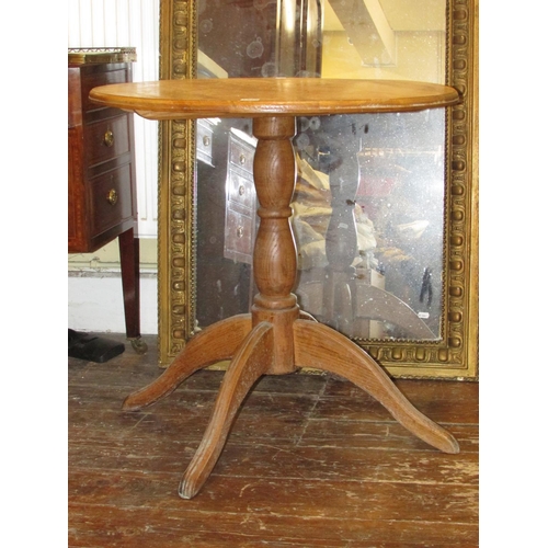 1332 - An old English style elm occasional table, the circular top on central pillar with quadruped