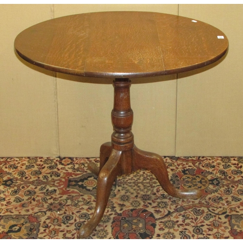 1336 - A Georgian oak tripod table, 80cm diameter top