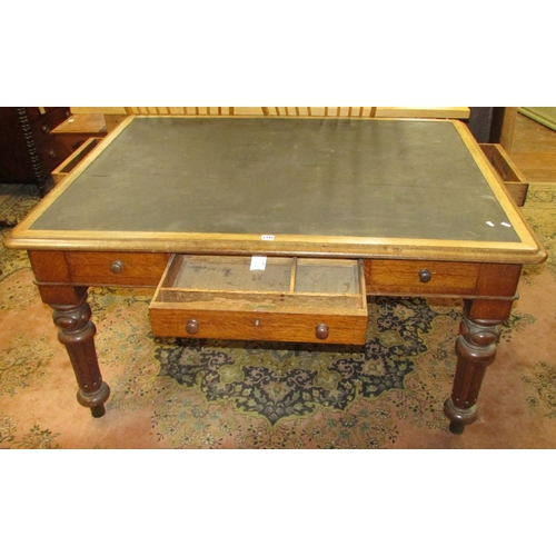 1344 - A Victorian oak writing desk with inset top over an arrangement of three real and three dummy drawer... 