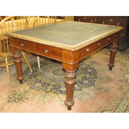 1344 - A Victorian oak writing desk with inset top over an arrangement of three real and three dummy drawer... 