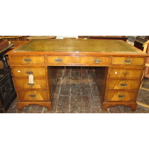 1351 - A good quality reproduction Georgian style twin pedestal desk in walnut, with mid-green coloured lea... 