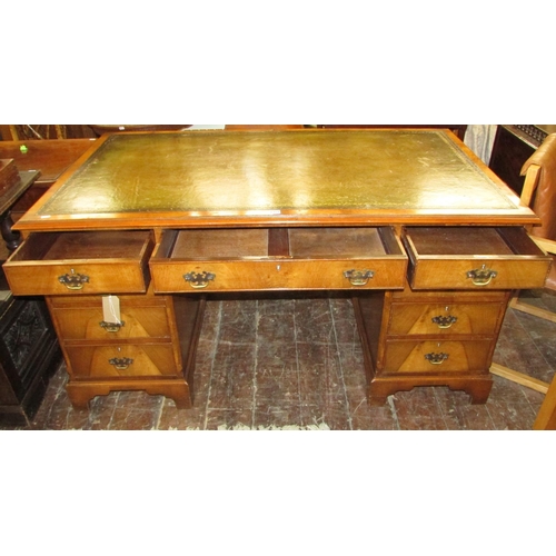 1351 - A good quality reproduction Georgian style twin pedestal desk in walnut, with mid-green coloured lea... 