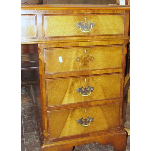 1351 - A good quality reproduction Georgian style twin pedestal desk in walnut, with mid-green coloured lea... 