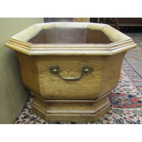 1467 - A large 19th oak century pale oak planter to an 18th century design of elongated octagonal form rais... 