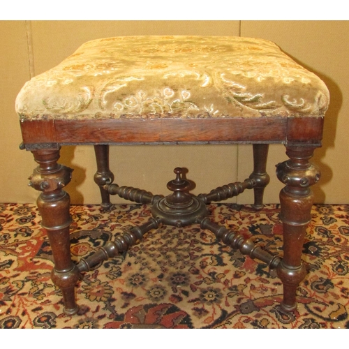 1352 - A Victorian rosewood centre stool raised on turned and tapering supports, united by four turned stre... 