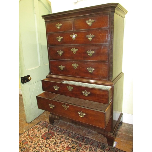 1353 - A George III mahogany chest on chest of diminutive proportions, the upper section with blind fret de... 