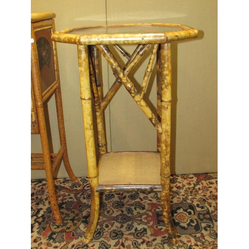 1360 - A Victorian bamboo occasional table of octagonal form, with lacquered and cane work finish, together... 