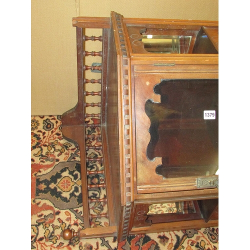 1379 - A late 19th century walnut hanging corner cupboard with mirrored recessed sides and spindle moulding... 