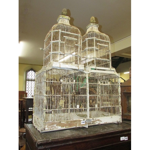 1382 - A 19th century timber and wire work twin domed bird cage with original painted finish by A. Nivet, w... 