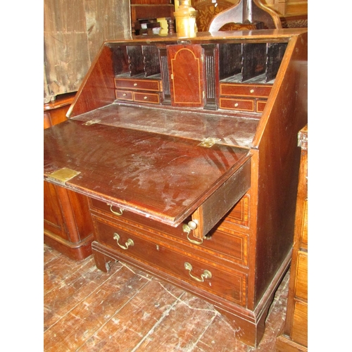 1397 - A good quality Edwardian mahogany bureau in the Georgian style, with four tapering frieze drawer, th... 