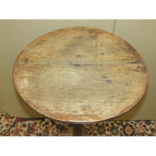 1400 - A simple Georgian countrymade occasional table in mixed woods, the oak top raised on a simple taperi... 