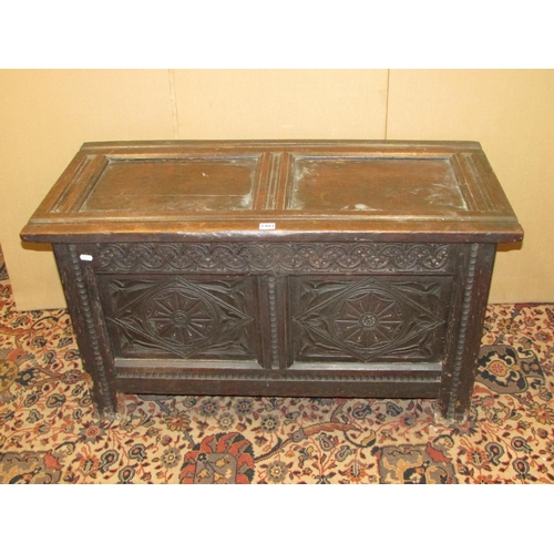 1403 - Early 18th century oak panelled coffer with carved finish, 105cm wide