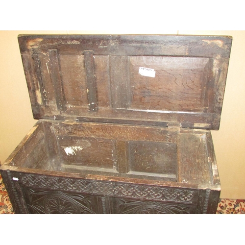 1403 - Early 18th century oak panelled coffer with carved finish, 105cm wide