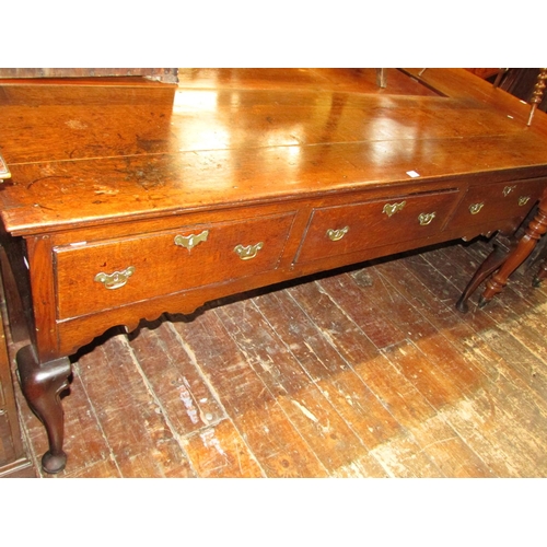 1407 - A Georgian oak dresser base fitted with three frieze drawers, shaped apron and shaped forelegs, 185c... 