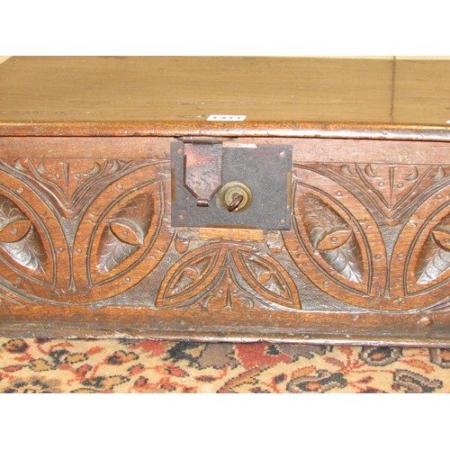 1411 - An 18th century oak bible box with carved front frieze, steel lock plate and hasp, 57cm wide