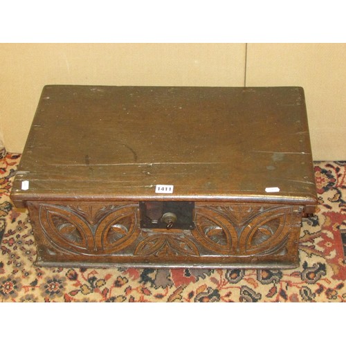 1411 - An 18th century oak bible box with carved front frieze, steel lock plate and hasp, 57cm wide