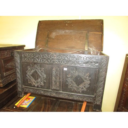 1415 - An 18th century oak coffer, the front elevation enclosed by two panels, with later geometric detail,... 