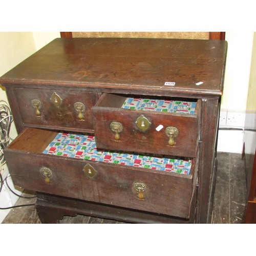 1429 - A small 18th century oak chest of two long and two drawers raised on bracket supports with pear drop... 