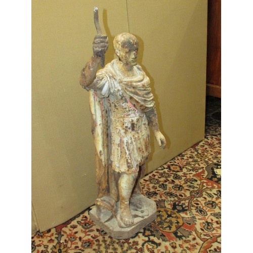 1432 - An antique cast iron figure of a Roman character one foot upon a dove with traces of painted finish,... 