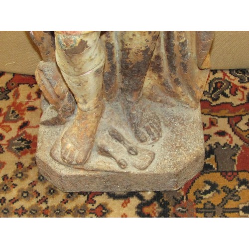 1432 - An antique cast iron figure of a Roman character one foot upon a dove with traces of painted finish,... 