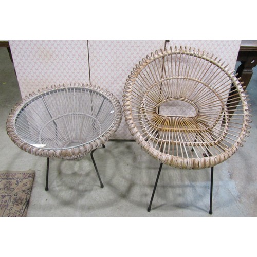 1243 - A vintage wicker two seat sofa, a mid century wicker plate glass occasional table of circular form a... 