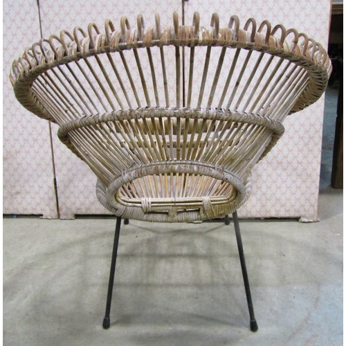 1243 - A vintage wicker two seat sofa, a mid century wicker plate glass occasional table of circular form a... 