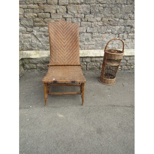 1254 - An Edwardian wicker conservatory chair with adjustable frame together with a wicker picnic stand