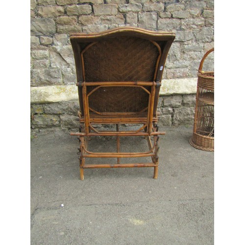 1254 - An Edwardian wicker conservatory chair with adjustable frame together with a wicker picnic stand