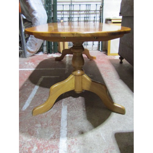 1459 - A contemporary pine kitchen table, the oval top raised on a stretcher base with central rail, 210cm ... 