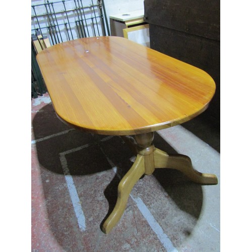 1459 - A contemporary pine kitchen table, the oval top raised on a stretcher base with central rail, 210cm ... 